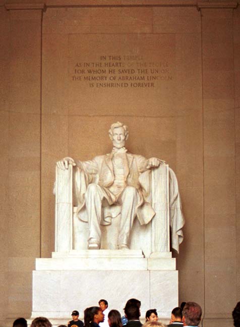 Staue of Lincoln with this inscription above: 'In this temple as in the hearts of the people for whom he saved the union the memory of Abraham Lincoln is enshrined forever'